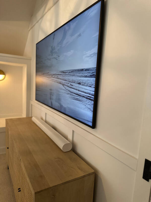 Detail of mounted TV and concealed soundbar wiring