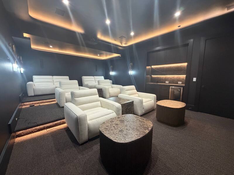 Rear angle with stepped rows, lit risers, and bar