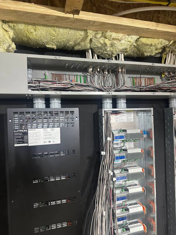 Lutron power panel next to dimming module enclosure
