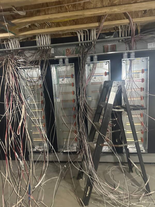Multiple Lutron panels with cables landed on terminal strips